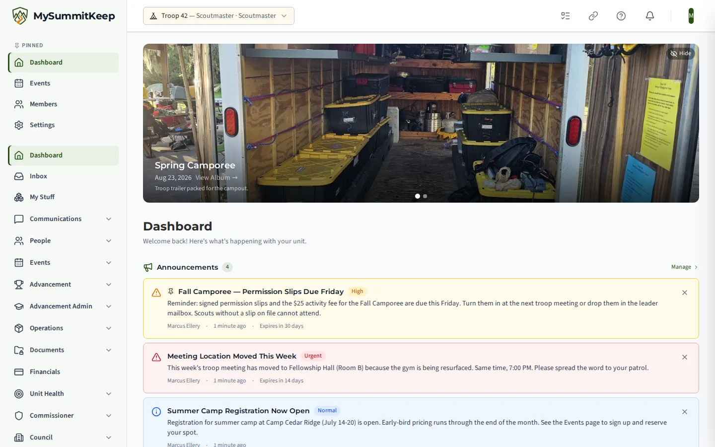 The unit dashboard showing a photo from the Spring Camporee of the troop trailer packed for a campout, followed by announcements about permission slips due, a changed meeting location and summer camp registration opening.